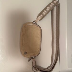 Compact Tan Belt Bag with Adjustable Strap and Zipper Closure